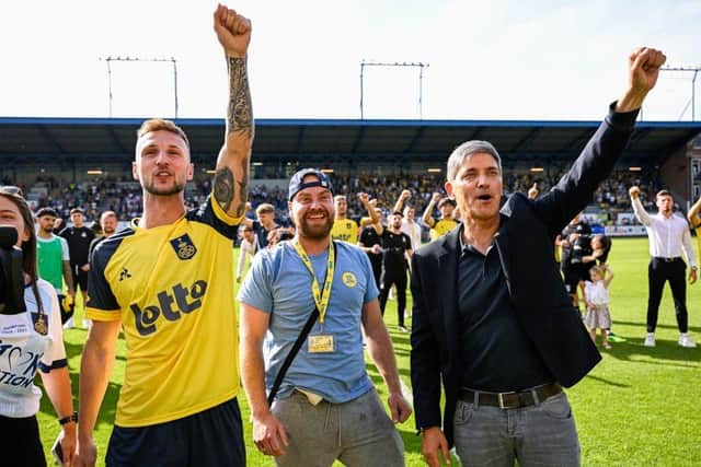 Union's Siebe Van Der Heyden, Dylan Crustin and last season's head coach Felice Mazzu celebrate second-place in the Jupiler League play-offs (Photo by LAURIE DIEFFEMBACQ/BELGA MAG/AFP via Getty Images)