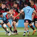 Mosese Tuipulotu, with ball in hand, playing for the Waratahs against the Crusaders in a Super Rugby Pacific match at Orangetheory Stadium in Christchurch. (Photo by Sanka Vidanagama / AFP via Getty Images)