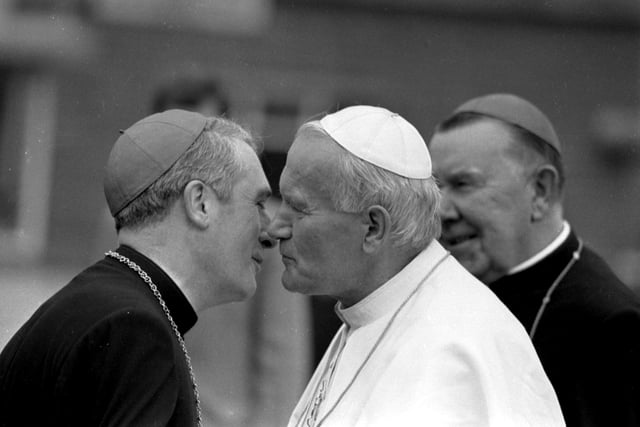 Pope John Paul II is greeted by Archbishop Thomas Winning (later Cardinal Winning) when he lands at Turnhouse Airport. Cardinal Winning had played a major role in ensuring the Papal visit went ahead.