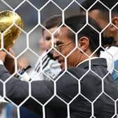 Nusret Goekce, nicknamed Salt Bae, gets his hands on the World Cup trophy last year in Qatar.