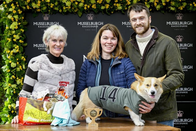 Winner of the Corgi Derby, Juno with his owners Fran Brandon and Alisdair Tew, is presented a trophy from Judy Murray at Musselburgh Racecourse