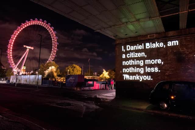 A line spoken by the title character in the Ken Loach film I, Daniel Blake is projected onto wall in London (Picture: Nicky J Sims/Getty Images for eOne)