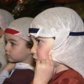 Here the children of the Thistle class at Mary Erskines and Stewart’s Melville Junior School are getting ready for their nativity performance. Picture: 8 December 2000.