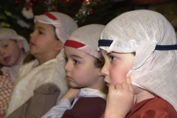 Here the children of the Thistle class at Mary Erskines and Stewart’s Melville Junior School are getting ready for their nativity performance. Picture: 8 December 2000.