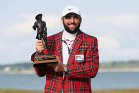 Scottie Scheffler celebrates with the trophy and the tartan jacket after winning the RBC Heritage at Harbour Town Golf Links in Hilton Head Island, South Carolina. Picture: Andrew Redington/Getty Images.