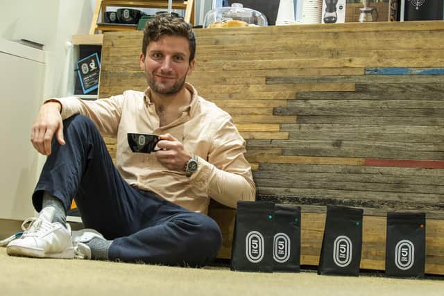 Former track cyclist Callum Skinner has opened a cafe on George Street, Edinburgh, where part of the coffee bar is made out of the wooden track from the old Meadowbank Velodrome. Picture: Lisa Ferguson