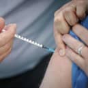 A person receives the Pfizer-BioNTech vaccine at a vaccination centre in York. Health Secretary Matt Hancock has said that as of 8am on Saturday morning, 350,000 people had been vaccinated.