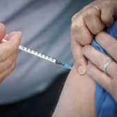 A person receives the Pfizer-BioNTech vaccine at a vaccination centre in York. Health Secretary Matt Hancock has said that as of 8am on Saturday morning, 350,000 people had been vaccinated.