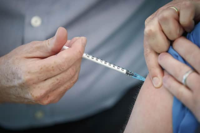 A person receives the Pfizer-BioNTech vaccine at a vaccination centre in York. Health Secretary Matt Hancock has said that as of 8am on Saturday morning, 350,000 people had been vaccinated.