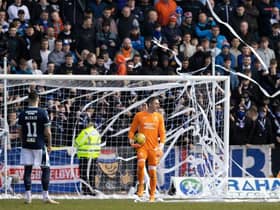 Play was stopped for the third time in the match at Dens Park on Sunday when Rangers fans again threw toilet rolls into the goalmouth. (Photo by Alan Harvey / SNS Group)