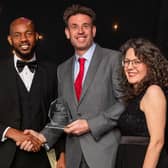Andy Buckworth (centre) from STATS Group receives the award for SME Employer of the Year