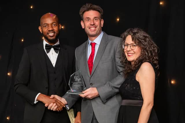 Andy Buckworth (centre) from STATS Group receives the award for SME Employer of the Year