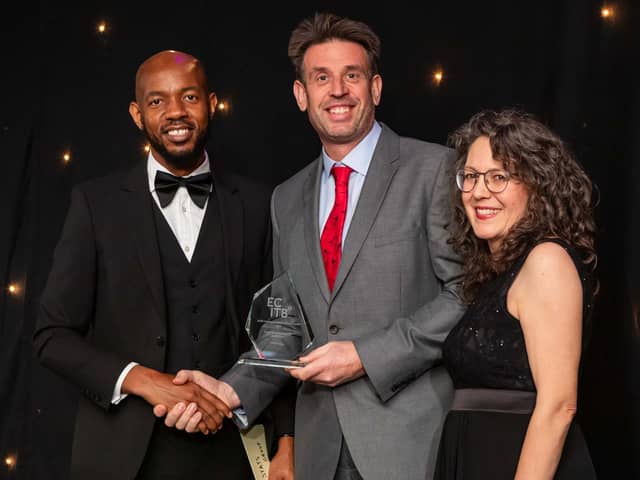 Andy Buckworth (centre) from STATS Group receives the award for SME Employer of the Year