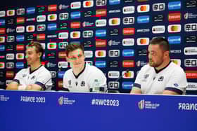 Scotland prop Zander Fagerson, right, with team-mates Jamie Ritchie, left, and Rory Darge at a press conference at the Velodrome stadium in Marseille ahead of the France 2023 Rugby World Cup.   (Photo by CLEMENT MAHOUDEAU/AFP via Getty Images)