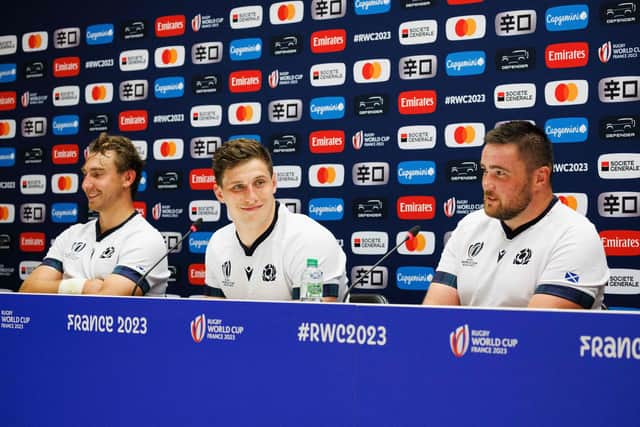 Scotland prop Zander Fagerson, right, with team-mates Jamie Ritchie, left, and Rory Darge at a press conference at the Velodrome stadium in Marseille ahead of the France 2023 Rugby World Cup.   (Photo by CLEMENT MAHOUDEAU/AFP via Getty Images)