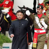 Pakistan's former president Pervez Musharraf (left) walks down after taking the oath as a civilian president at the presidential palace in Islamabad. Picture: Aamir Qureshi/AFP via Getty Images