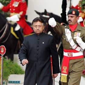 Pakistan's former president Pervez Musharraf (left) walks down after taking the oath as a civilian president at the presidential palace in Islamabad. Picture: Aamir Qureshi/AFP via Getty Images