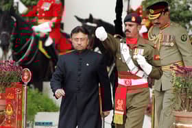 Pakistan's former president Pervez Musharraf (left) walks down after taking the oath as a civilian president at the presidential palace in Islamabad. Picture: Aamir Qureshi/AFP via Getty Images