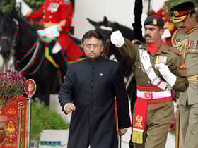 Pakistan's former president Pervez Musharraf (left) walks down after taking the oath as a civilian president at the presidential palace in Islamabad. Picture: Aamir Qureshi/AFP via Getty Images