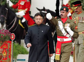 Pakistan's former president Pervez Musharraf (left) walks down after taking the oath as a civilian president at the presidential palace in Islamabad. Picture: Aamir Qureshi/AFP via Getty Images
