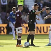 Referee Steven McLean (centre) ruled out Scott Arfiield's strike in Rangers' 4-0 win over Hearts at Tynecastle.