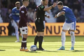 Referee Steven McLean (centre) ruled out Scott Arfiield's strike in Rangers' 4-0 win over Hearts at Tynecastle.