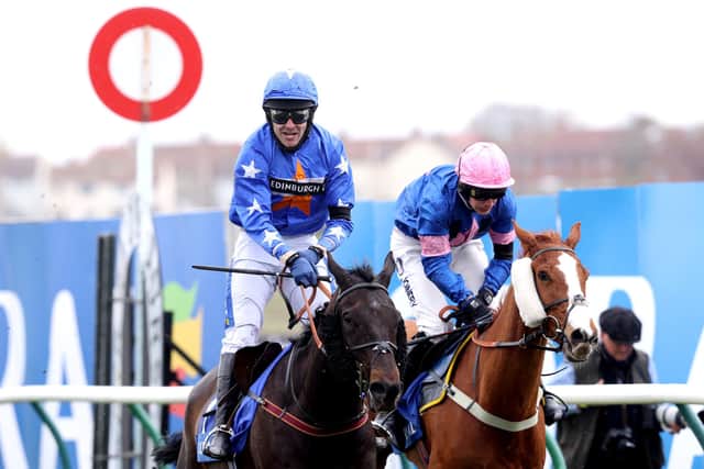 Mighty Thunder ridden by Tom Scudamore (left) wins the Coral Scottish Grand National Handicap Chase during the Coral Scottish Grand National Day at Ayr Racecourse. Picture: Jeff Holmes/PA Wire