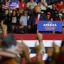 Supporters raise their right arm and finger as Donald Trump speaks at a Save America Rally to support Republican candidates running for office in Ohio (Picture: Jeff Swensen/Getty Images)