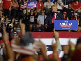 Supporters raise their right arm and finger as Donald Trump speaks at a Save America Rally to support Republican candidates running for office in Ohio (Picture: Jeff Swensen/Getty Images)