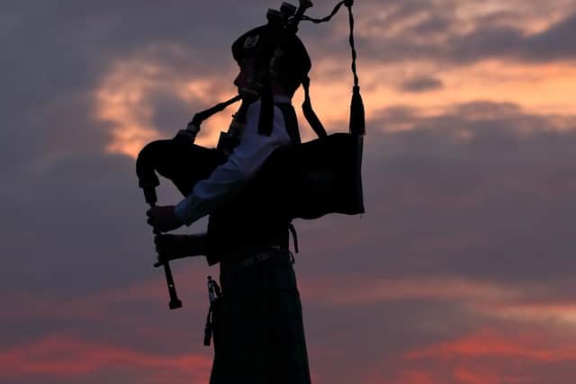 A piper plays for the Candle of Hope ceremony.