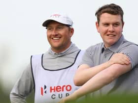 Bob MacIntyre shares a joke with his caddie, Mike Thomson, during the Hero Cup at Abu Dhabi Golf Club. Picture: Andrew Redington/Getty Images.