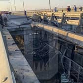 This picture reportedly shows damaged parts of an automobile link of the Crimean Bridge connecting Russian mainland and Crimean peninsula over the Kerch Strait not far from Kerch, Crimea. Traffic on the key bridge connecting Crimea to Russia’s mainland was halted on Monday, after reports of explosions that Crimean officials said were from a Ukrainian attack.