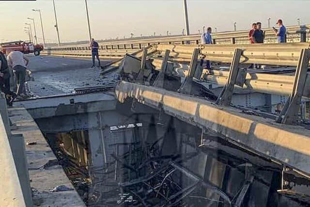 This picture reportedly shows damaged parts of an automobile link of the Crimean Bridge connecting Russian mainland and Crimean peninsula over the Kerch Strait not far from Kerch, Crimea. Traffic on the key bridge connecting Crimea to Russia’s mainland was halted on Monday, after reports of explosions that Crimean officials said were from a Ukrainian attack.