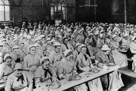 Women have dinner at a workhouse in London in around 1900 (Picture: General Photographic Agency/Getty Images)