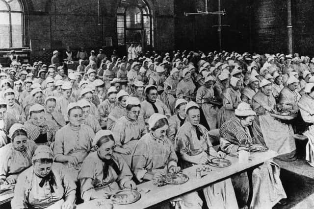 Women have dinner at a workhouse in London in around 1900 (Picture: General Photographic Agency/Getty Images)