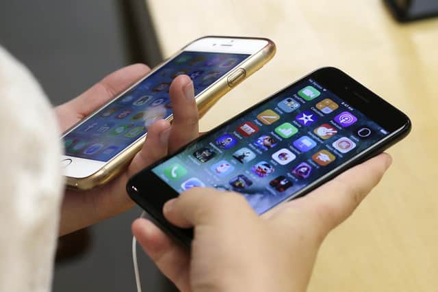 IPhone owners in the US could be set for a cash windfall. Picture: AP Photo/Kiichiro Sato