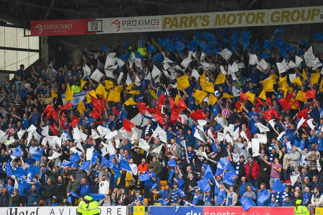 St Johnstone supporters wave flags ahead of kick-off at a sold-out McDiarmid Park . (Photo by Craig Foy / SNS Group)