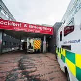 An ambulance arrives at A&E, but will there be room for the patient? (Picture: John Devlin)