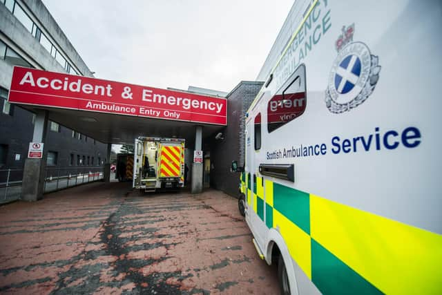 An ambulance arrives at A&E, but will there be room for the patient? (Picture: John Devlin)