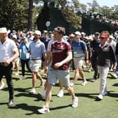 Greg Norman of Australia, CEO and Commissioner of LIV Golf, walks with patrons during the 88th Masters at Augusta National Golf Club. Picture: Warren Little/Getty Images.