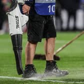 Staff at Hampden Park work on the waterlogged pitch during Scotland's Euro 2024 qualifying win over Georgia. (Photo by Craig Foy / SNS Group)