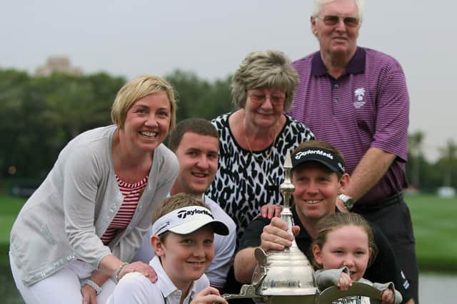 Stephen Gallacher and his family poses with the iconic Dallah Trophy after his win in 2014. Picture: MarwanNaamani/AFP via Getty Images.