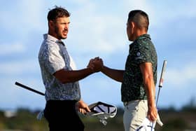 Brooks Koepka, left, and Collin Morikawa shake hands during the final round of the 2021 Hero World Challenge at Albany Golf Course in Nassau. Picture: Mike Ehrmann/Getty Images.