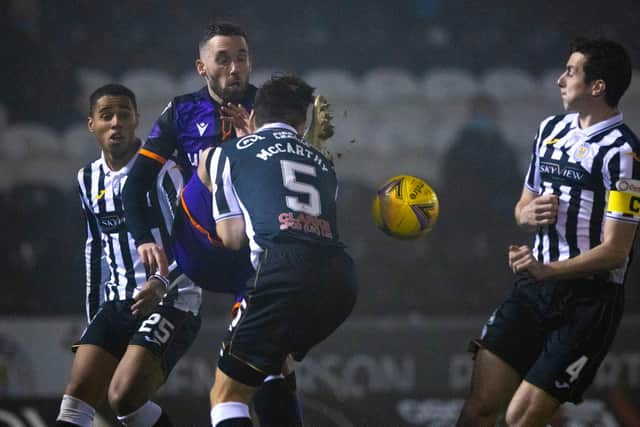 PAISLEY, SCOTLAND - NOVEMBER 06: Dundee United's Nicky Clark is swarmed by St Mirren players as a call for high boot is made during a Scottish Premiership match between St Mirren and Dundee United at the SMISA Stadium on November 06, 2020, in Paisley, Scotland. (Photo by Craig Williamson / SNS Group)