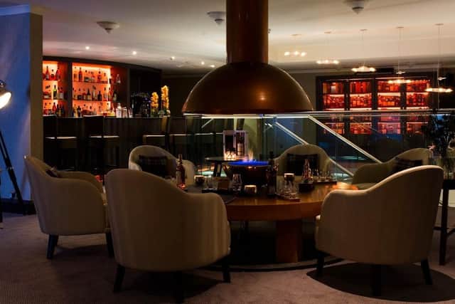 The snug bar offers a retreat from the busy capital, boasts an open fire pit and offers platters of charcuterie and cheeses to accompany a dram. Pic: Contributed