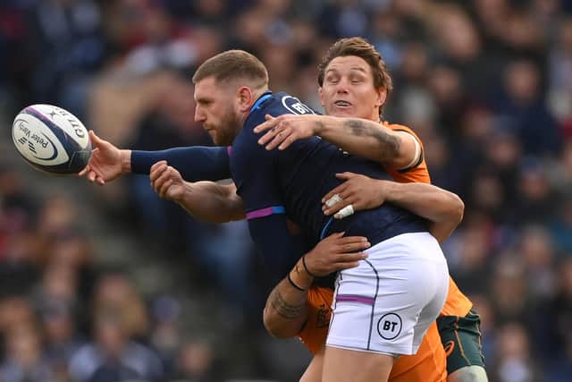 Wallabies captain Michael Hooper gets to grips with Scotland stand-off Finn Russell during the recent match at Murrayfield. (Photo by Stu Forster/Getty Images)