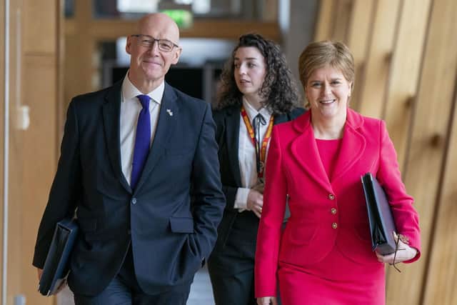 First Minister Nicola Sturgeon and Deputy First Minister John Swinney (left) arrive for First Minster's Questions. Picture: Jane Barlow/PA Wire
