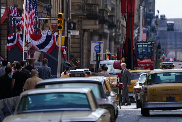 A body double for Harrison Ford on Cochrane Street in Glasgow city centre during filming the new Indiana Jones 5 movie starring Harrison Ford in July 2021.