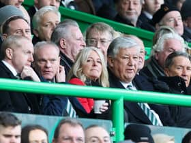 Former Celtic chief executive Peter Lawwell (right) watches a match at Celtic Park with his son Mark (left).