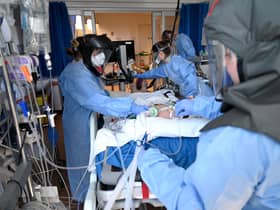 NHS staff who put their lives at risk to save others should be allowed to live in this country (Picture: Neil Hall/pool/AFP via Getty Images)